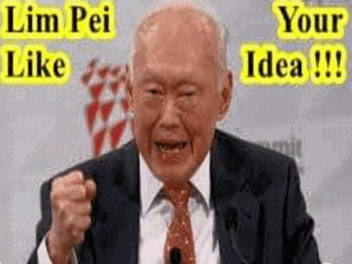 A Man In A Suit And Tie Is Making A Funny Face While Giving A Speech . GIF