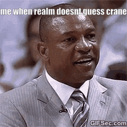 A Man In A Suit And Tie Is Making A Funny Face While Talking On A Microphone . GIF