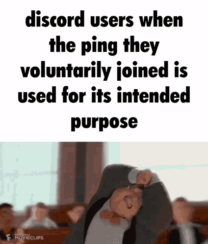 A Man In A Suit And Tie Is Making A Funny Face With His Arms Outstretched . GIF