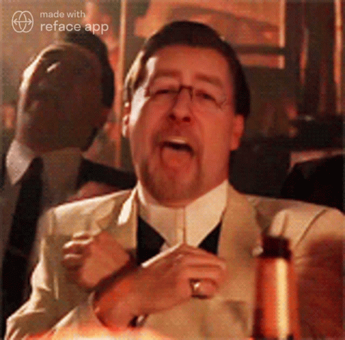 A Man In A Suit And Tie Is Making A Funny Face With The Reface App GIF