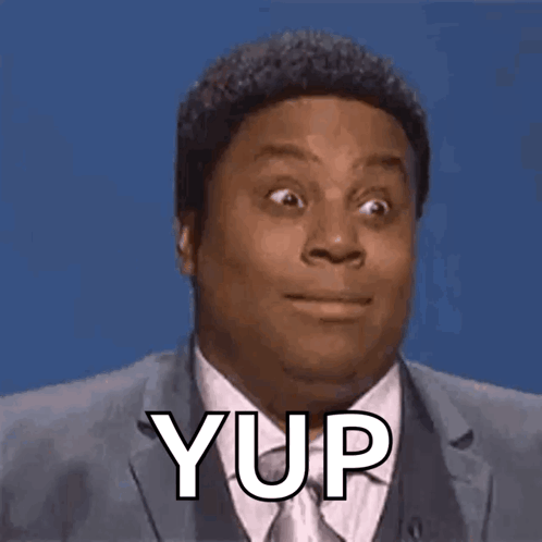A Man In A Suit And Tie Is Making A Funny Face With The Word Yup . GIF