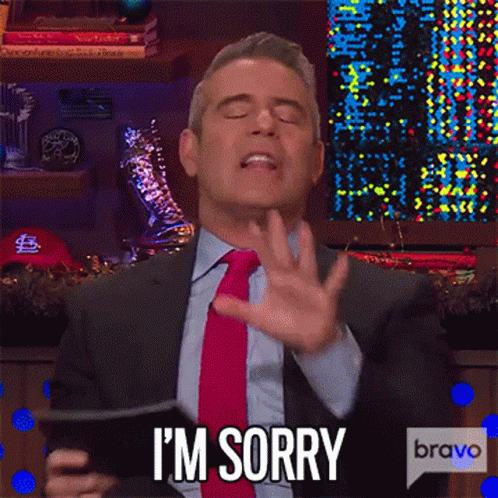 Man In Suit Making Sorry Gesture With Phone GIF