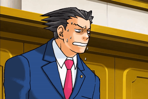 A Man In A Suit And Tie Is Making A Surprised Face GIF