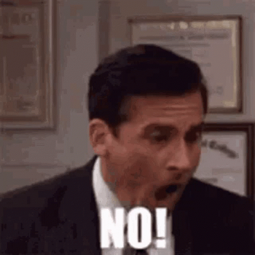a man in a suit and tie is making a surprised face and saying `` no '' .