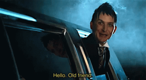 A Man In A Suit And Tie Is Peeking Out Of A Car Window And Says Hello Old Friend GIF