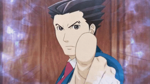 A Man In A Suit And Tie Is Pointing At Something GIF