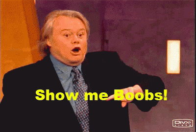 A Man In A Suit And Tie Is Pointing At The Camera And Says Show Me Boobs GIF