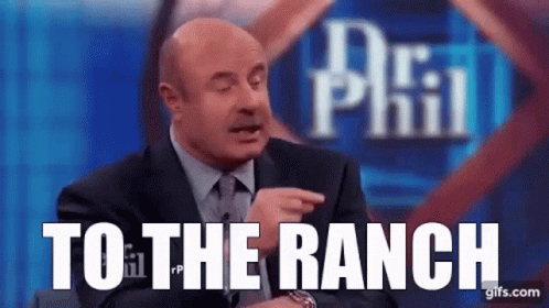 A Man In A Suit And Tie Is Pointing At The Camera And Says `` To The Ranch '' . GIF