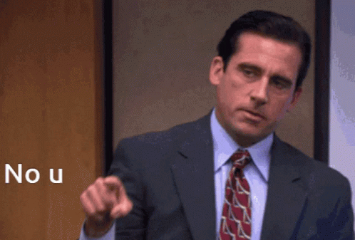 A Man In A Suit And Tie Is Pointing At The Camera With The Word No U Behind Him GIF