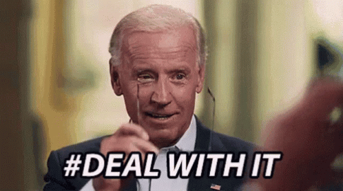 A Man In A Suit And Tie Is Pointing At The Camera With The Words `` Deal With It '' Written Below Him . GIF