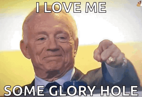 A Man In A Suit And Tie Is Pointing At The Camera With The Words I Love Me Some Glory Hole Below Him GIF