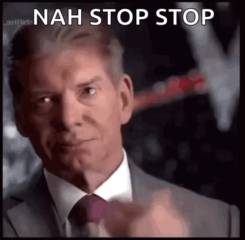 A Man In A Suit And Tie Is Pointing At The Camera With The Words Nah Stop Stop Below Him GIF