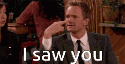 A Man In A Suit And Tie Is Pointing His Finger At His Nose And Says I Saw You GIF