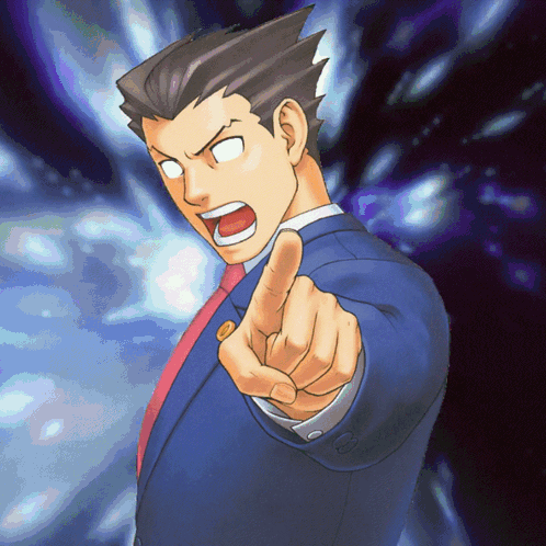 A Man In A Suit And Tie Is Pointing His Finger At The Camera GIF
