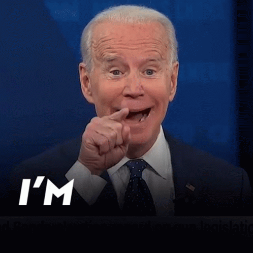 A Man In A Suit And Tie Is Pointing With The Words I 'M Coming Below Him GIF