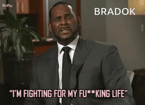 A Man In A Suit And Tie Is Saying Bradok GIF