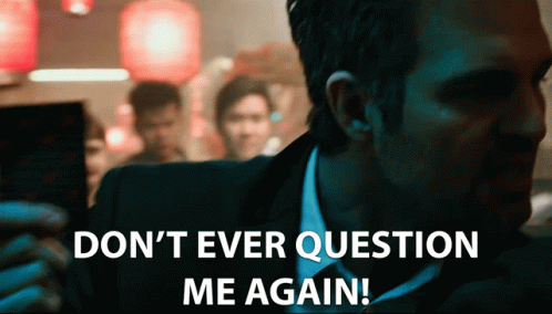 a man in a suit and tie is saying " do n't ever question me again "