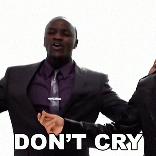 A Man In A Suit And Tie Is Saying " Don 'T Cry " GIF