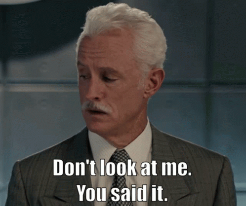 A Man In A Suit And Tie Is Saying " Don 'T Look At Me You Said It " GIF