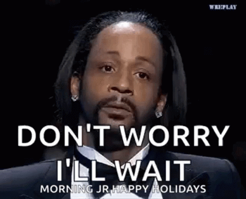 A Man In A Suit And Tie Is Saying `` Don T Worry I 'Ll Wait '' . GIF