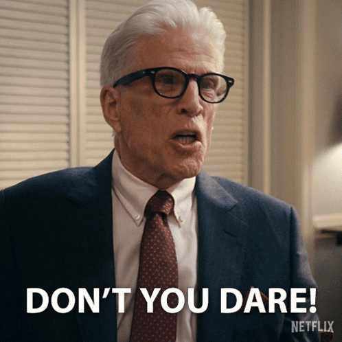A Man In A Suit And Tie Is Saying " Don 'T You Dare " GIF