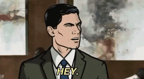 A Man In A Suit And Tie Is Saying `` Hey '' In A Cartoon . GIF