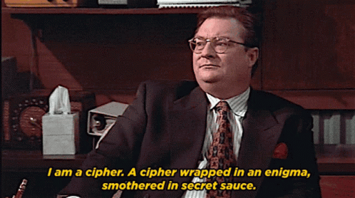 A Man In A Suit And Tie Is Saying I Am A Cipher GIF