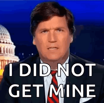 A Man In A Suit And Tie Is Saying `` I Did Not Get Mine '' While Standing In Front Of The Capitol Building . GIF