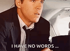 A Man In A Suit And Tie Is Saying `` I Have No Words '' . GIF