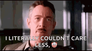 A Man In A Suit And Tie Is Saying `` I Literally Could N't Care Less '' . GIF