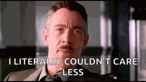 A Man In A Suit And Tie Is Saying `` I Literally Couldn 'T Care Less '' GIF