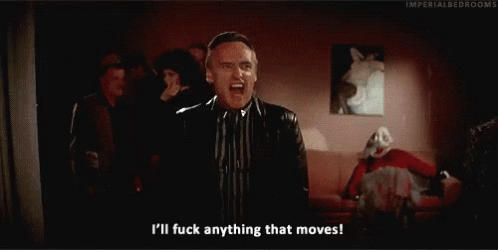A Man In A Suit And Tie Is Saying I 'Ll Fuck Anything That Moves . GIF