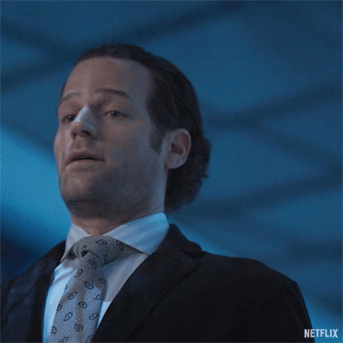 A Man In A Suit And Tie Is Saying " I 'Ll Take A Step Back " GIF