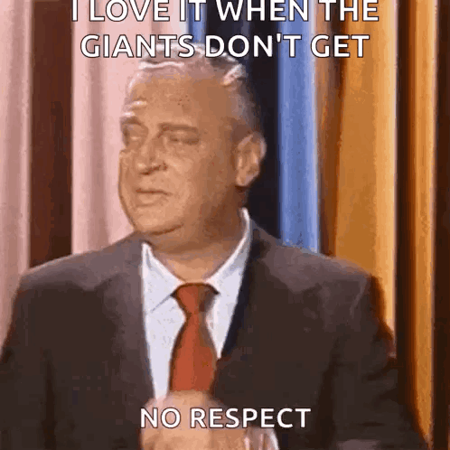 A Man In A Suit And Tie Is Saying I Love It When The Giants Don 'T Get No Respect GIF