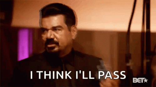 A Man In A Suit And Tie Is Saying `` I Think I 'Ll Pass '' In A Blurry Photo . GIF