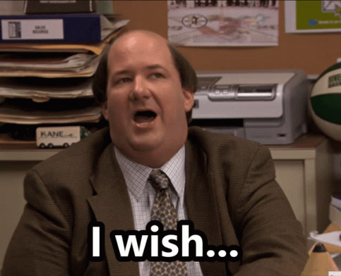 A Man In A Suit And Tie Is Saying " I Wish " GIF