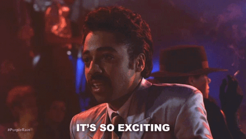A Man In A Suit And Tie Is Saying It 'S So Exciting In A Club . GIF
