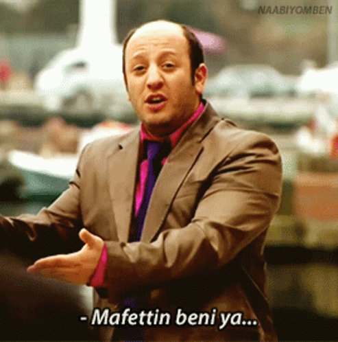 A Man In A Suit And Tie Is Saying Mafettin Beni Ya GIF