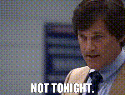A Man In A Suit And Tie Is Saying " Not Tonight " GIF