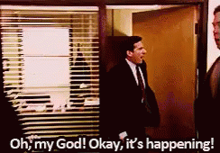 A Man In A Suit And Tie Is Saying Oh My God Okay It 'S Happening . GIF