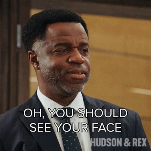 A Man In A Suit And Tie Is Saying Oh You Should See Your Face GIF