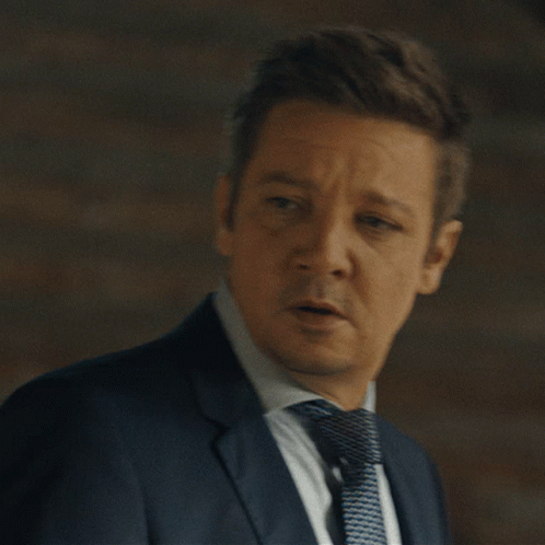 A Man In A Suit And Tie Is Saying " That 'S The Spirit " GIF