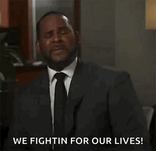 A Man In A Suit And Tie Is Saying `` We Fightin For Our Lives ! '' GIF