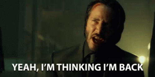 A Man In A Suit And Tie Is Saying Yeah , I 'M Thinking I 'M Back GIF