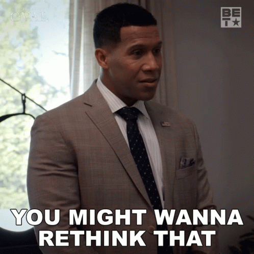 a man in a suit and tie is saying you might wanna rethink that