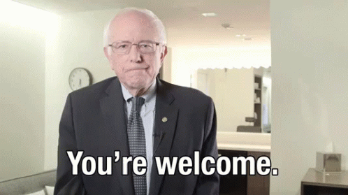 A Man In A Suit And Tie Is Saying " You 'Re Welcome " GIF
