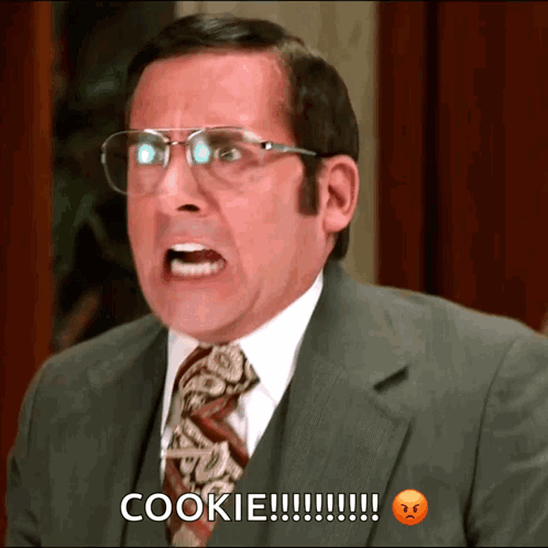 A Man In A Suit And Tie Is Screaming And Saying Cookie GIF