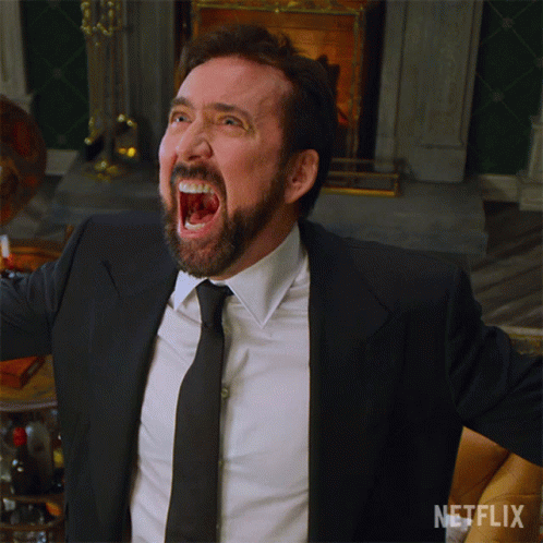 A Man In A Suit And Tie Is Screaming In Front Of A Fireplace With A Netflix Logo In The Corner GIF