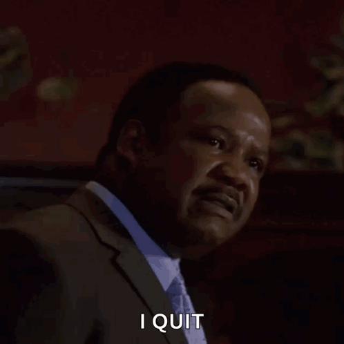 A Man In A Suit And Tie Is Screaming With The Words I Quit Behind Him GIF