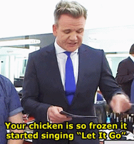 A Man In A Suit And Tie Is Singing Let It Go GIF